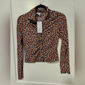 NWT floral print long-sleeve blouse.